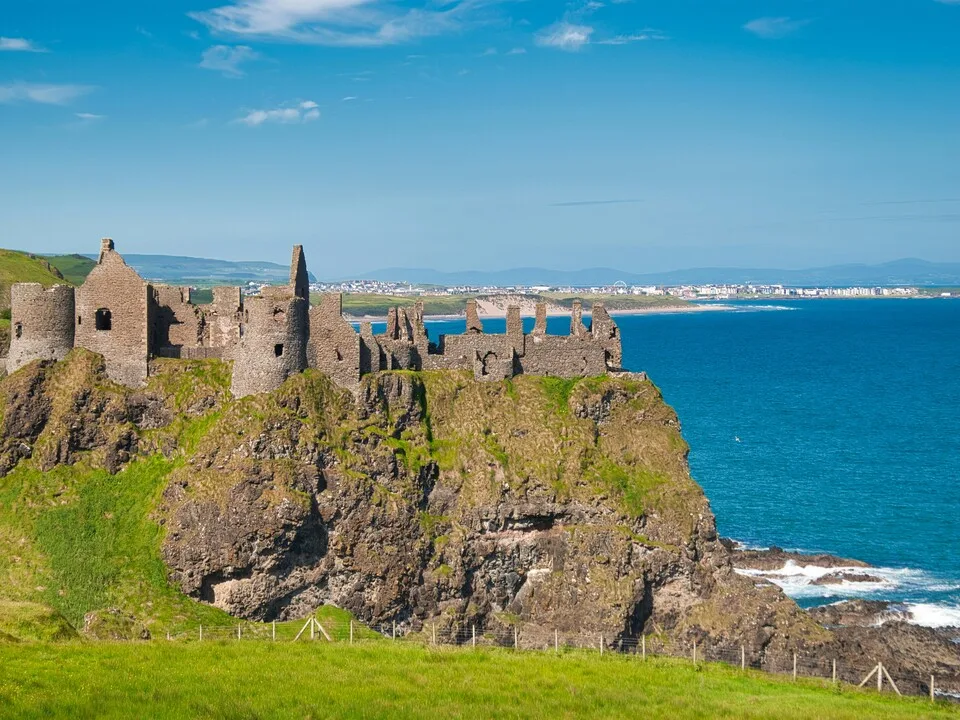 Dunluce Castle ruins perched on a basalt cliff edge