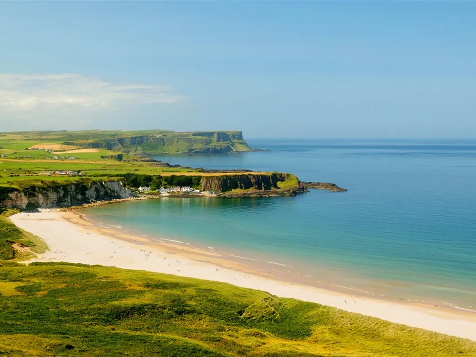 The wide sandy crescent of White Park Bay
